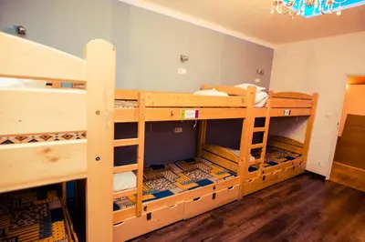 a room with two bunk beds in a room at Greg&Tom Beer House Hostel in Kraków