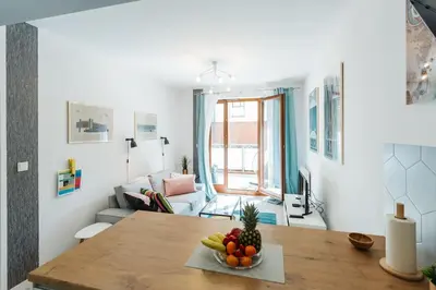 a room with a table with a bowl of fruit on it at Nica Old Town Free Parking Spacious Sunny Terrace in Kraków