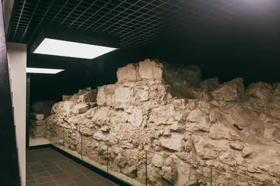 a rock wall in a room with a ceiling at Harmonica Old Town with Free Parking in Kraków
