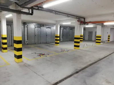 an empty parking garage with yellow and black poles at Presto by Housine,pl Zator in Zator