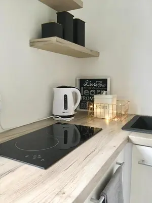 a kitchen with a counter top with a toaster on it at Apartament 212 in Klikuszowa