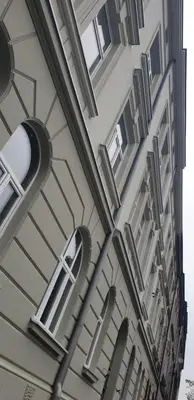 a building with windows and a street light at Barbakan Residence Old Town in Kraków
