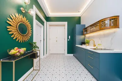 a kitchen with a blue and green wall at Art of Serenity in Kraków
