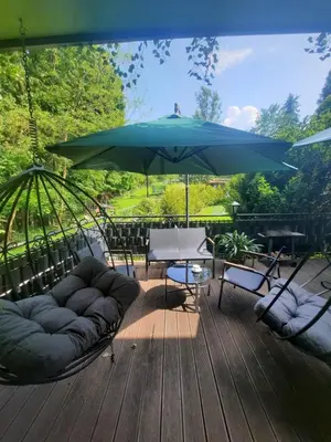 a blue hammock with a stuffed animal in it at Gościna U kowala in Lachowice