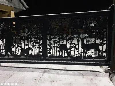 a metal fence with silhouettes of horses on it at Osada Babiogórska - domki gościnne in Zawoja