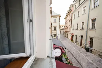 a view of a street from a window of a building at VINTAGE SENACKA APARTAMENTS in Kraków