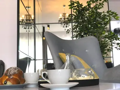 a table with two cups of coffee and a pastry at Glamour Apartment with big, private terrace in Kraków