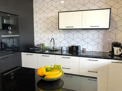 a bowl of fruit on a table in a kitchen at Glamour Apartment with big, private terrace in Kraków