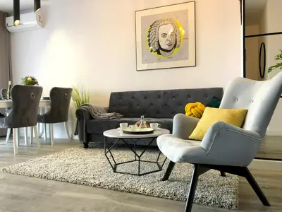 a living room with a couch and a table at Glamour Apartment with big, private terrace in Kraków