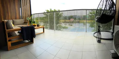 a screened in porch with a view of a pool at Glamour Apartment with big, private terrace in Kraków