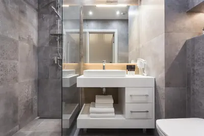 a bathroom with a sink and a mirror at City of the Kings - City Point Green - Rajska 3 in Kraków