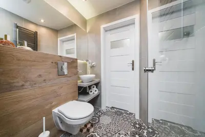 a bathroom with a toilet and a sink at Liv Apartments Old Town in Kraków