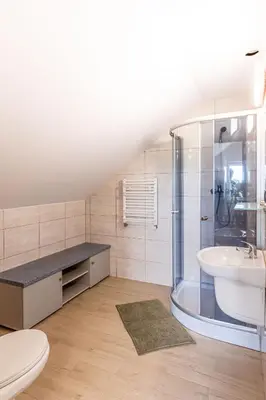 a bathroom with a shower and a sink and a toilet at Motel OLIV in Oświęcim