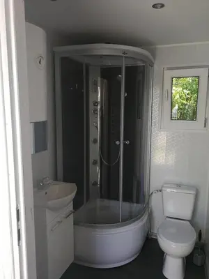 a bathroom with a tub and a toilet and a sink at Motel OLIV in Oświęcim