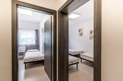 a mirror in a room with two beds at Motel OLIV in Oświęcim