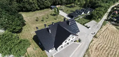 an overhead view of a house with a black roof at Motel OLIV in Oświęcim