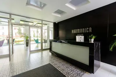 a lobby with a reception desk in a building at Central Kazimierz Apartment with balcony in Kraków