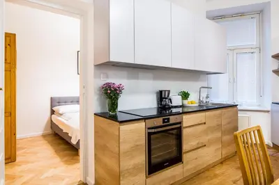 a kitchen with a sink and a counter top at Apartament Na Groblach in Kraków