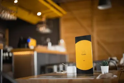 a yellow and black pole sitting on a table at Apartamenty Szlachecki Dwór in Pobiednik Wielki