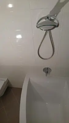 a bath tub in a bathroom with a sink at Quiet and spacious apartment with garage option in Kraków