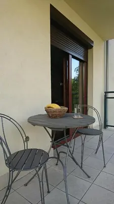 a table with two chairs and a basket on it at Quiet and spacious apartment with garage option in Kraków