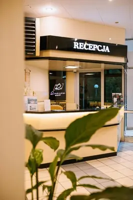 a restaurant with a counter in a store at Ośrodek Szkoleniowo Wypoczynkowy ROŻNÓW in Rożnów