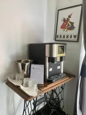 a wooden shelf with a coffee maker on it at Topolove Rooms & Apartments in Kraków