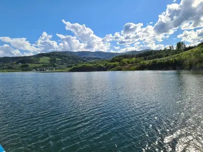 a view of a lake with mountains in the background at PoziomKA in Jaszczurowa