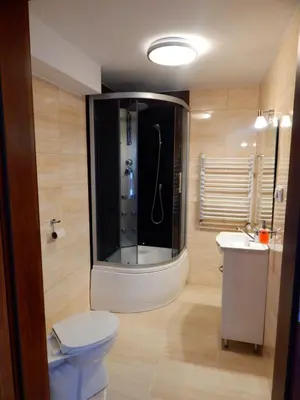 a bathroom with a shower and a toilet and a sink at PoziomKA in Jaszczurowa