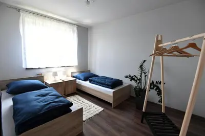 a bedroom with a bed and a bunk bed at Apartament U Grazi in Spytkowice