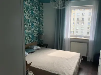 a bedroom with a bed and a window at Cystersów 10 by Atrium Apartments in Kraków