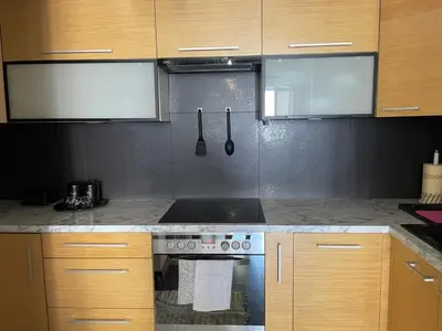 a kitchen with a stove and a counter top at Cystersów 10 by Atrium Apartments in Kraków