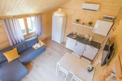 an overhead view of a living room and kitchen in a tiny house at Słoneczny Ogród domki letniskowe Zator in Zator