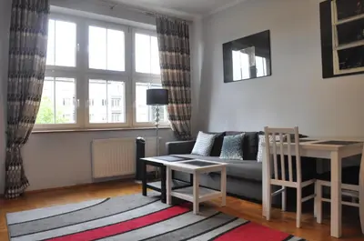 a living room with a couch and a table at aleja Krasińskiego 30 by Homeprime in Kraków