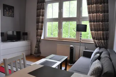 a living room with a couch and a table at aleja Krasińskiego 30 by Homeprime in Kraków