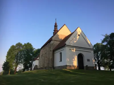 an old church on top of a hill at Dom Pod Orzechem in Łapczyca