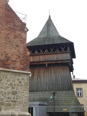 a large building with a large roof with a tower at Dom Pod Orzechem in Łapczyca