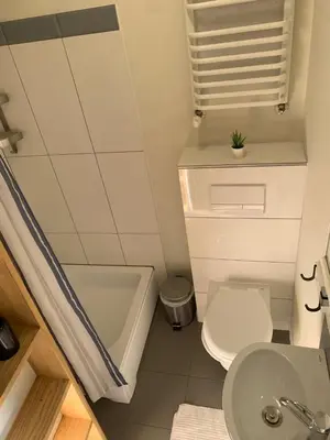 a small bathroom with a toilet and a sink at Boleslav Home in Sucha Beskidzka