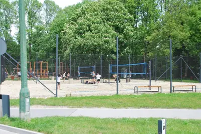 a park with people playing in a playground at THE HEART OF NOWA HUTA - free garage in Kraków