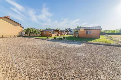 a gravel driveway with houses in the background at FamilyCamp in Zator