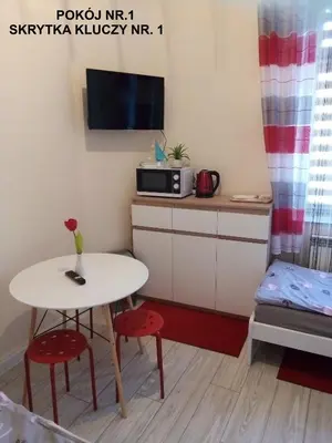 a small kitchen with a table and a microwave at Torino in Zator