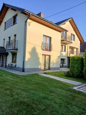 a large house with a lawn in front of it at Agroturystyka u Krzysztofa ZATOR ,ENERGYLANDIA , NOCLEGI in Graboszyce