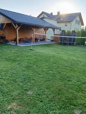 a house with a large yard with a pavilion at Agroturystyka u Krzysztofa ZATOR ,ENERGYLANDIA , NOCLEGI in Graboszyce