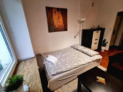 a small bedroom with a bed in a room at Krakow Centrum Gurgacza Apartments in Kraków