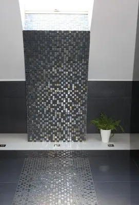 a bathroom with a shower with a tiled floor at Apartament STUDIO i Apartament ZADOMEK Spytkowice koło ZATORA in Spytkowice