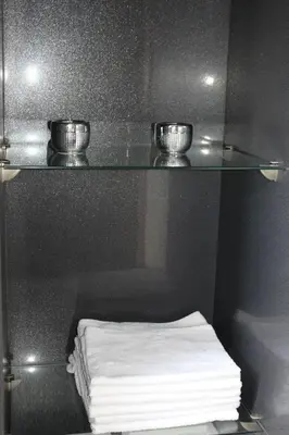 a bathroom with a shelf with two bowls on it at Apartament STUDIO i Apartament ZADOMEK Spytkowice koło ZATORA in Spytkowice