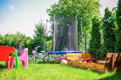 a park with a playground with a play structure at Apartament Na Szkolnej in Zator