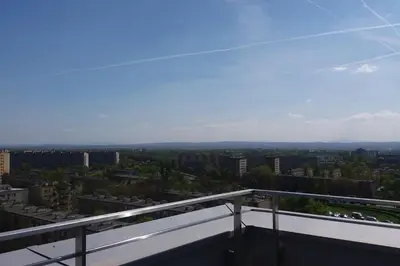 a view of the city from the balcony of a building at Luksusowy apartament z tarasem in Kraków