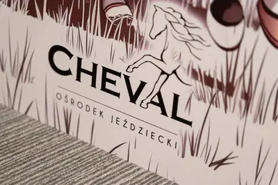 a drawing of a cat on a sign on a wall at Pokoje Gościnne Cheval in Kraków