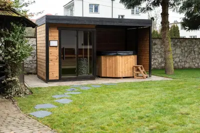 a small wooden shed in a yard at Pokoje Gościnne Cheval in Kraków